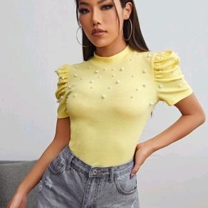 Light yellow rouged sleeve with pearl accent